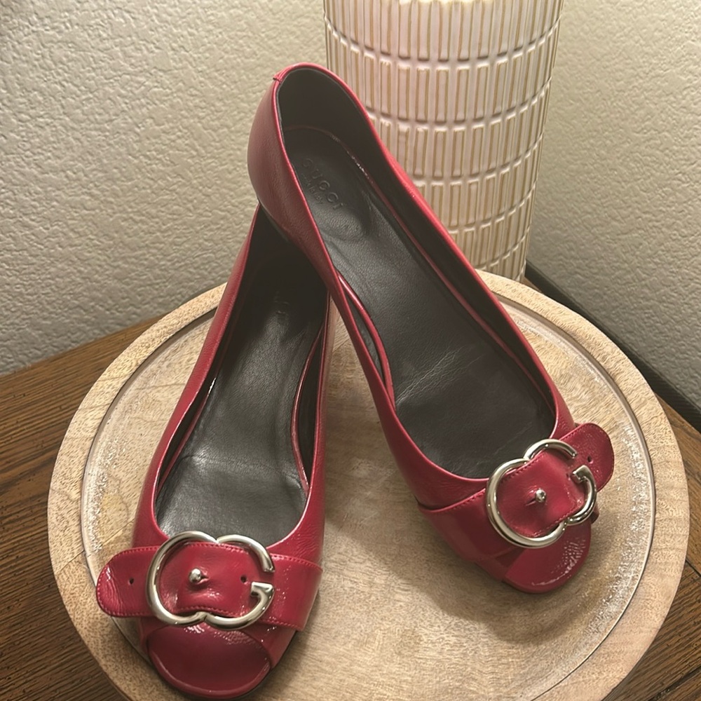 Gucci patent leather peep toe flats.